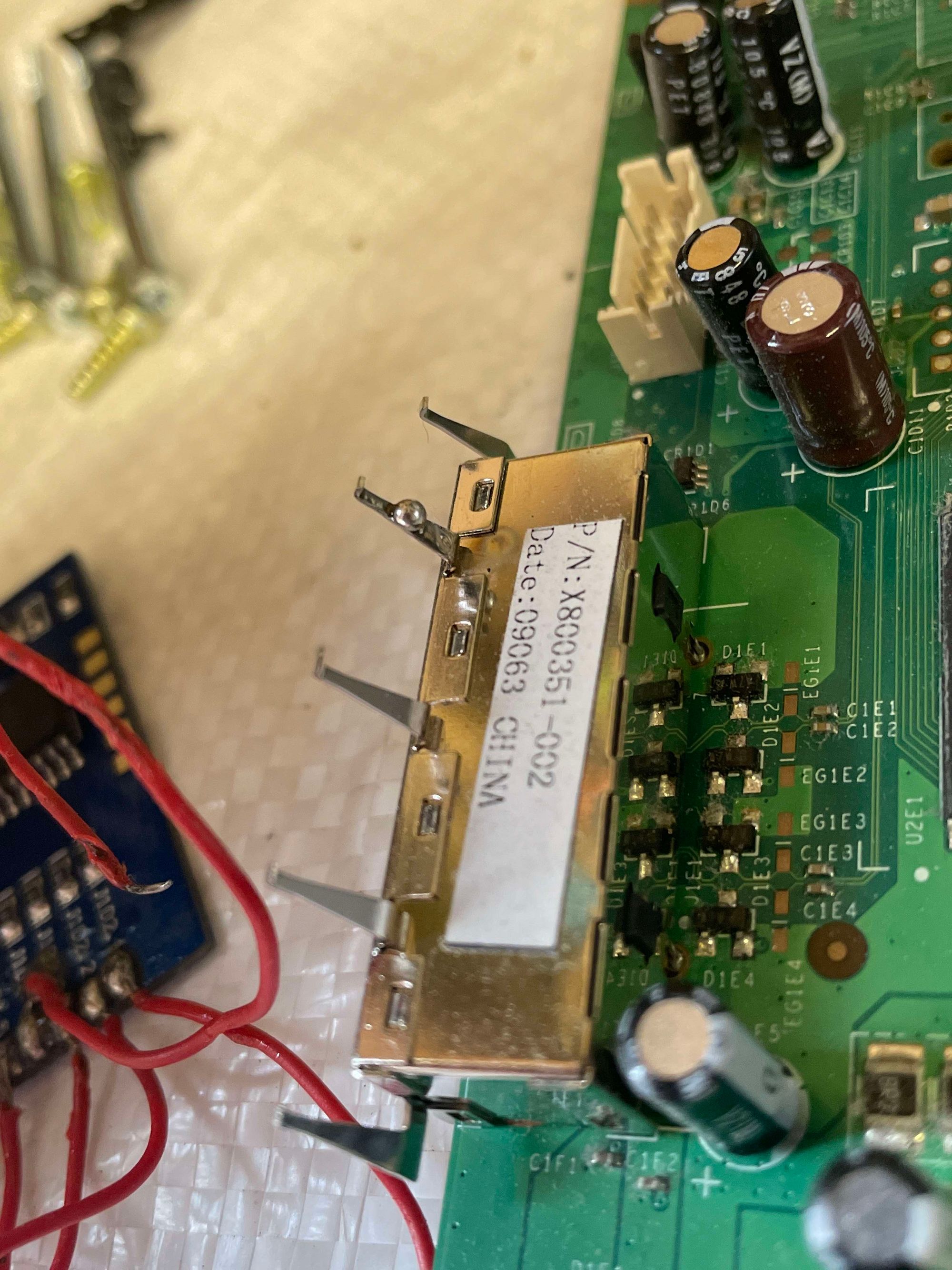 Image showing the HDD prong on a motherboard with solder on it