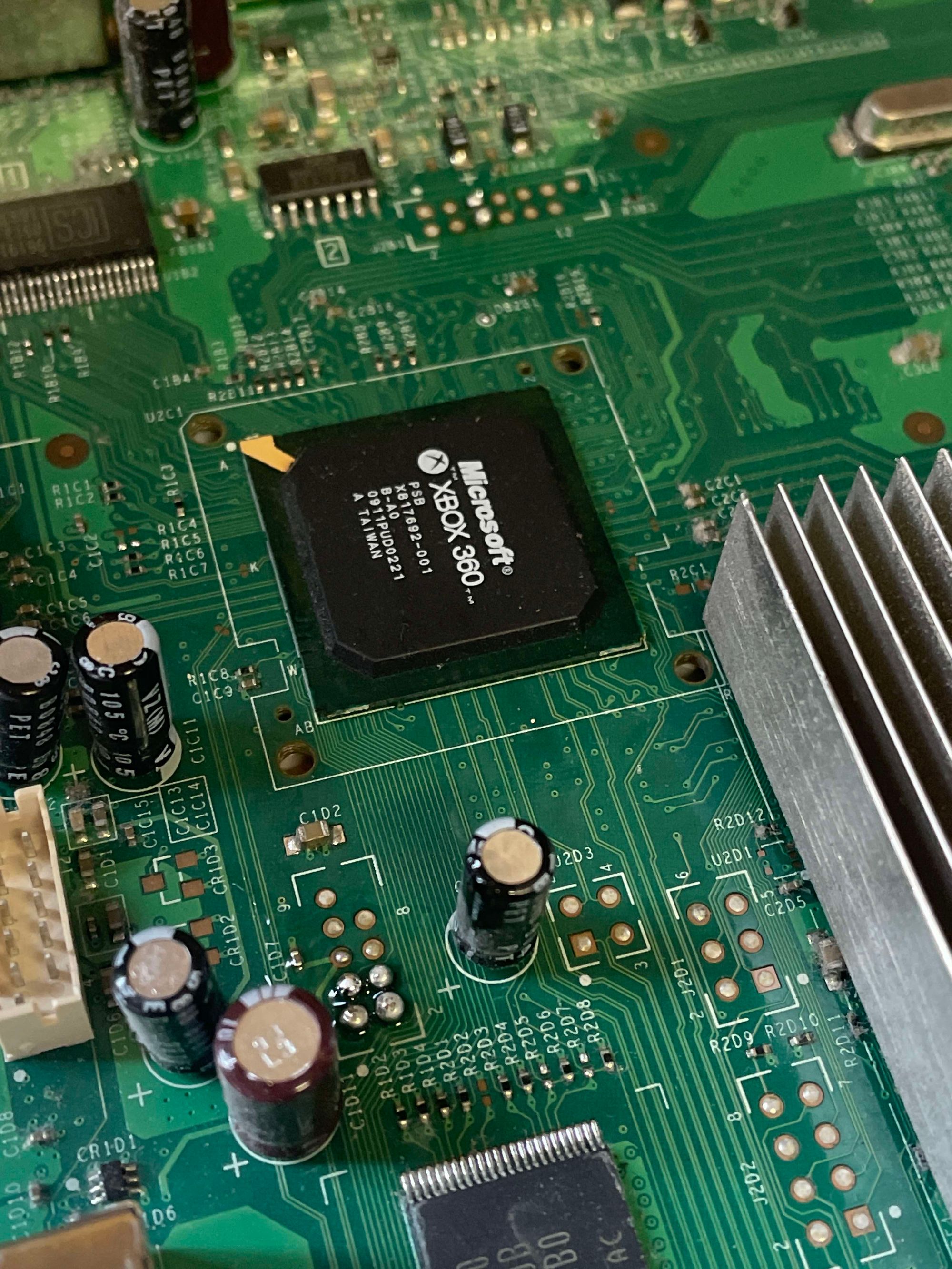 Image showing the NAND headers on the motherboard with balls of solder